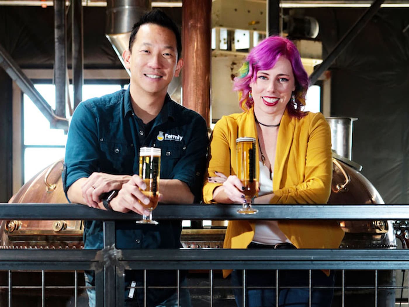 Frances and Danny consulting over beers